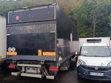 many trucks that are parked in a parking lot