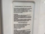 an image of a white refrigerator with a label on it