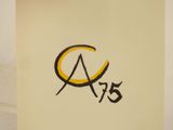 a picture of a yellow and black logo on a piece of paper
