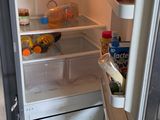 an open refrigerator with a lot of food inside of it