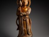 an image of a statue of a person holding a bird