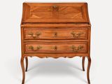 an old wooden bureau with drawers and drawers on top of it
