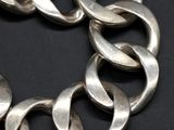 an image of a close up of a chain bracelet