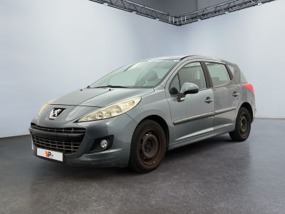 the grey car is parked in a large room with white walls