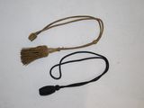 two different types of hair ties on a white surface