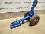 a close up of a blue hand truck with a red wheel