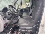 a picture of the inside of a van with the driver ' s seat down