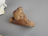a statue of a man with a beard on a table