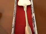 a fork and a spoon in a box on a table