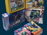 three boxes of legos sitting next to each other on a table
