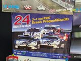 a lot of racing cars on display in a store