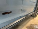 a close up of a car door with a sticker on it