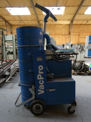 a blue machine that is sitting inside of a building