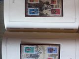 deux livres portant des timbres posés sur une table