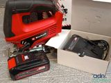 a box with a power tool and a battery in it