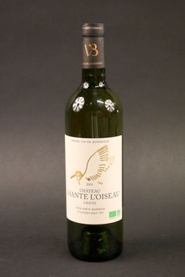 a bottle of wine that is sitting on a table