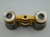 an image of a pair of binoculars sitting on top of a table