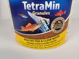 tetramin granules for fish and algaes in a tub
