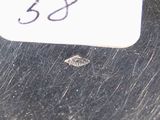 a picture of a tag on a piece of metal