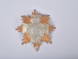 an image of a gold star with a crown on it