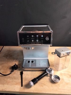 a coffee machine that is sitting on a wooden table