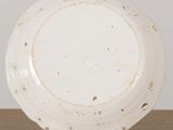 an image of a white plate sitting on top of a wooden table