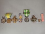 many medals and medals that are on the table