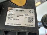 a close up of a gas pump with a sticker on it