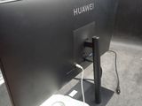 a picture of a computer monitor with a power strip attached to it