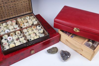 two red boxes with different types of rocks in them