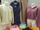 a display of clothing on a table in a room