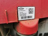 a close up of a red truck with a barcode on it ' s side