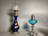 two glass vases sitting next to each other on a table