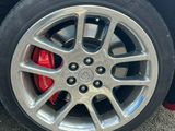 a close up of a tire on a red car