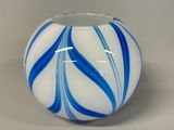 a blue and white vase sitting on a table