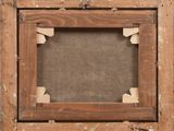 an old picture frame with a piece of wood sticking out of it