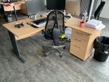 a desk with a chair and a computer monitor on it