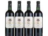 three bottles of wine sitting next to each other on a white surface
