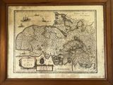 an old map of the country of england in a wooden frame