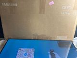 a laptop that is sitting on a table in front of a box