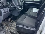 the interior of a car with the driver ' s seat folded down