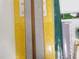 a box with a pencil, ruler, eraser, and other items on it