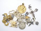 a lot of religious items that are on a table