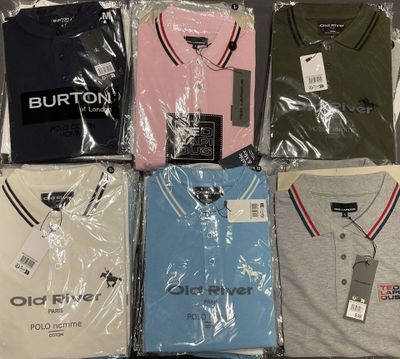 six men ' s polo shirts in plastic bags on a table