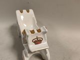 porcelain figurine of a bathtub with a crown on the back
