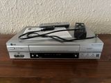 a dvd player that is sitting on top of a table
