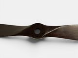 a close up of a propeller blade on a white surface