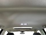 the interior of a car with the sunroof down and the back seats down