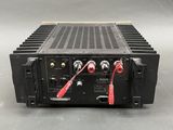 a close up of a black amplifier on a gray surface