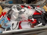 a metal container filled with assorted items in a store